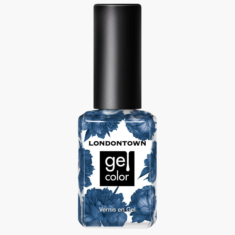A bottle of LONDONTOWN's "To the Moon" gel color nail polish with a black cap, adorned with elegant blue floral designs and featuring a rich crème blue finish. Perfect for use with UV/LED light.