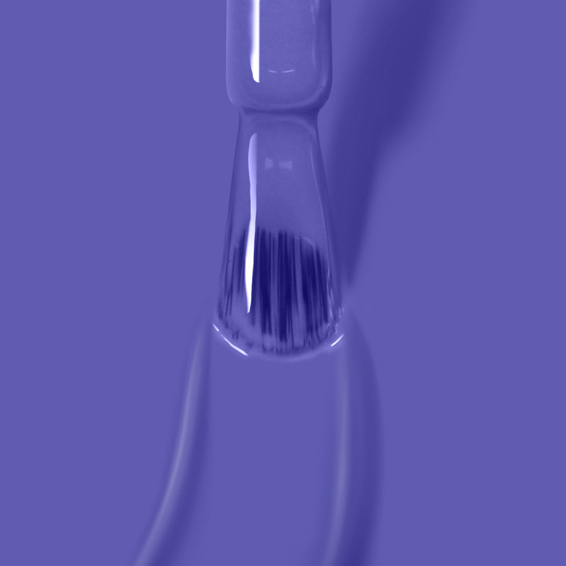 Close-up of a brush applying LONDONTOWN's Uptown, a bold purple, vegan nail polish.