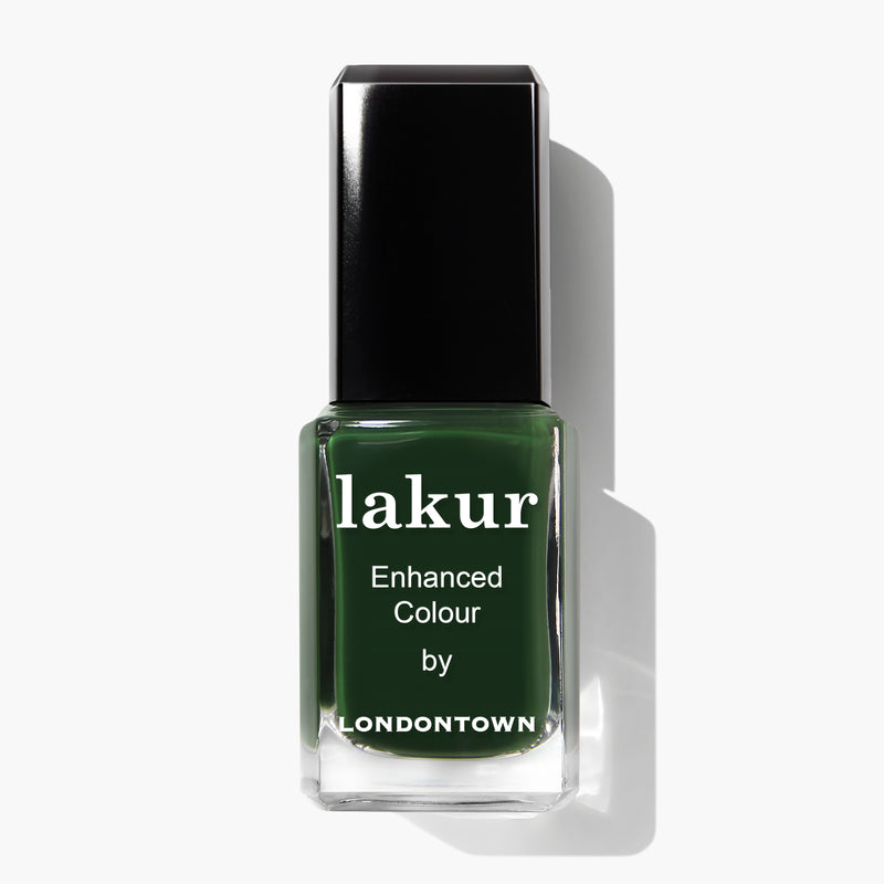 A bottle of Vibe nail polish by LONDONTOWN in a rich jade green shade is displayed against a white background.