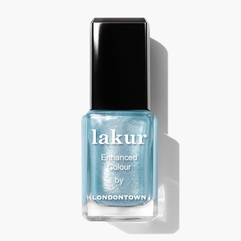A bottle of Whipped Blueberry nail polish with a dazzling sky blue shade, featuring a shiny black cap and the brand name "LONDONTOWN" on the label.